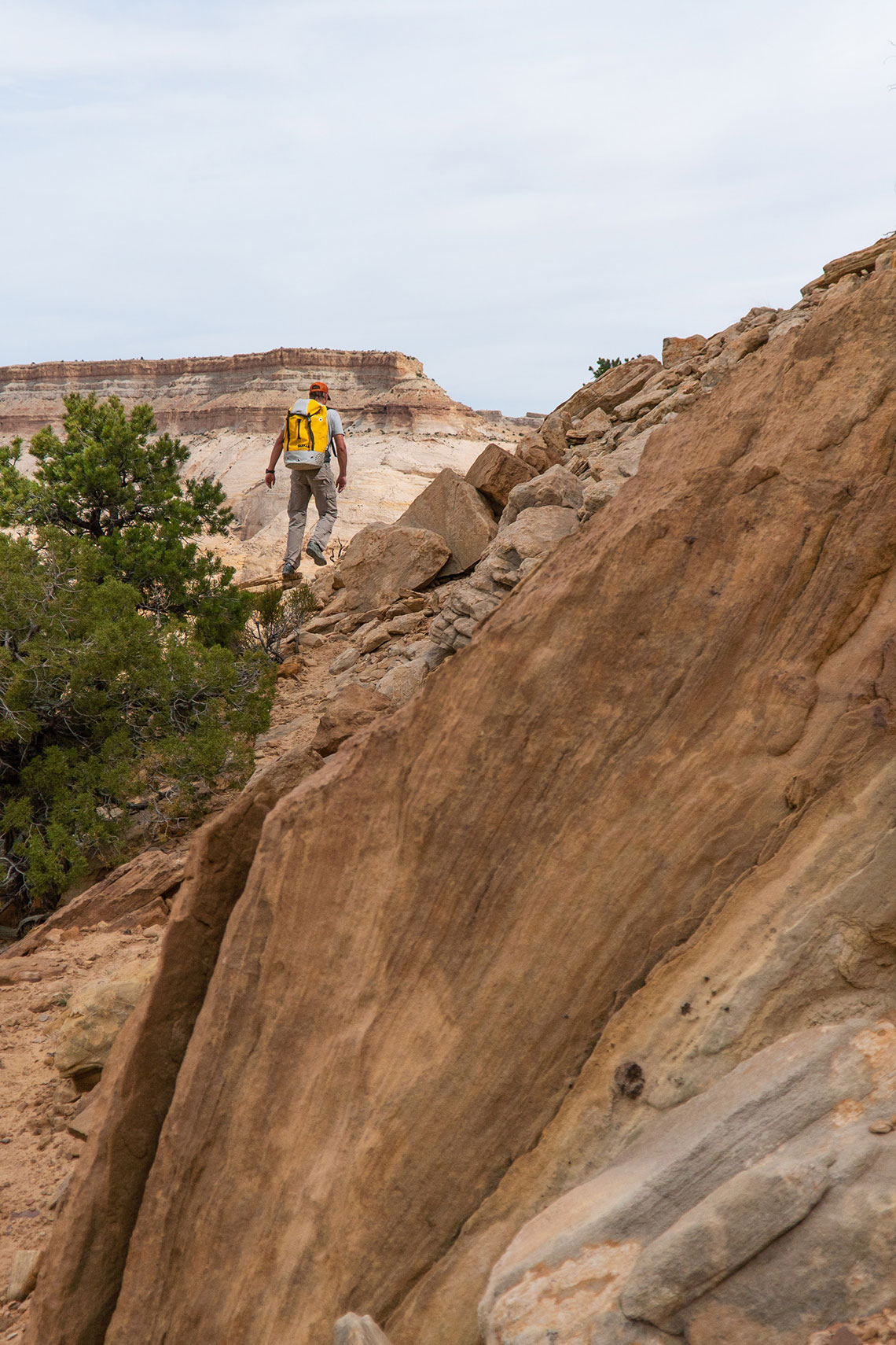 Walking around the point of the plateau on the approach to Wonderland Canyon