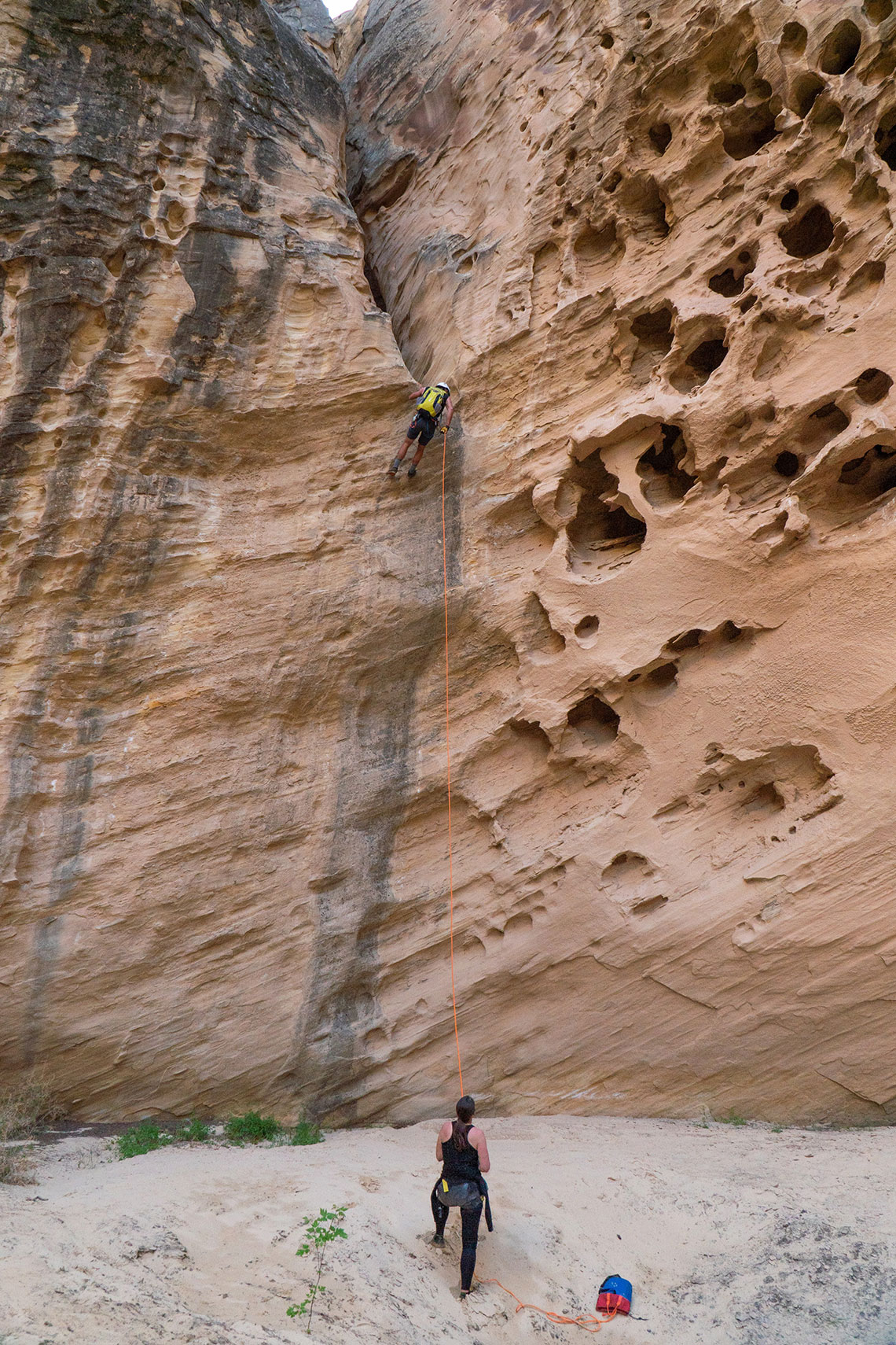 Belaying at the bottom of rappel 4 in Wonderland Canyon