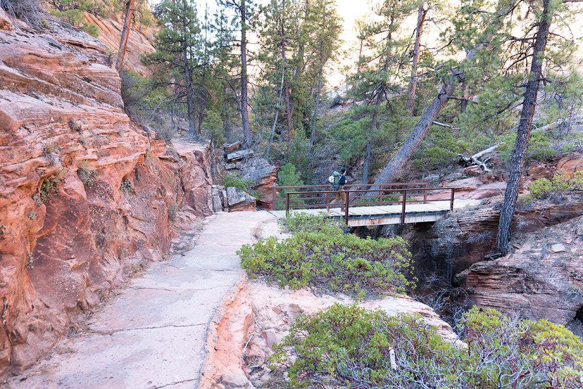 Walking across the bridge on the West Rim Trail in Zion National Park