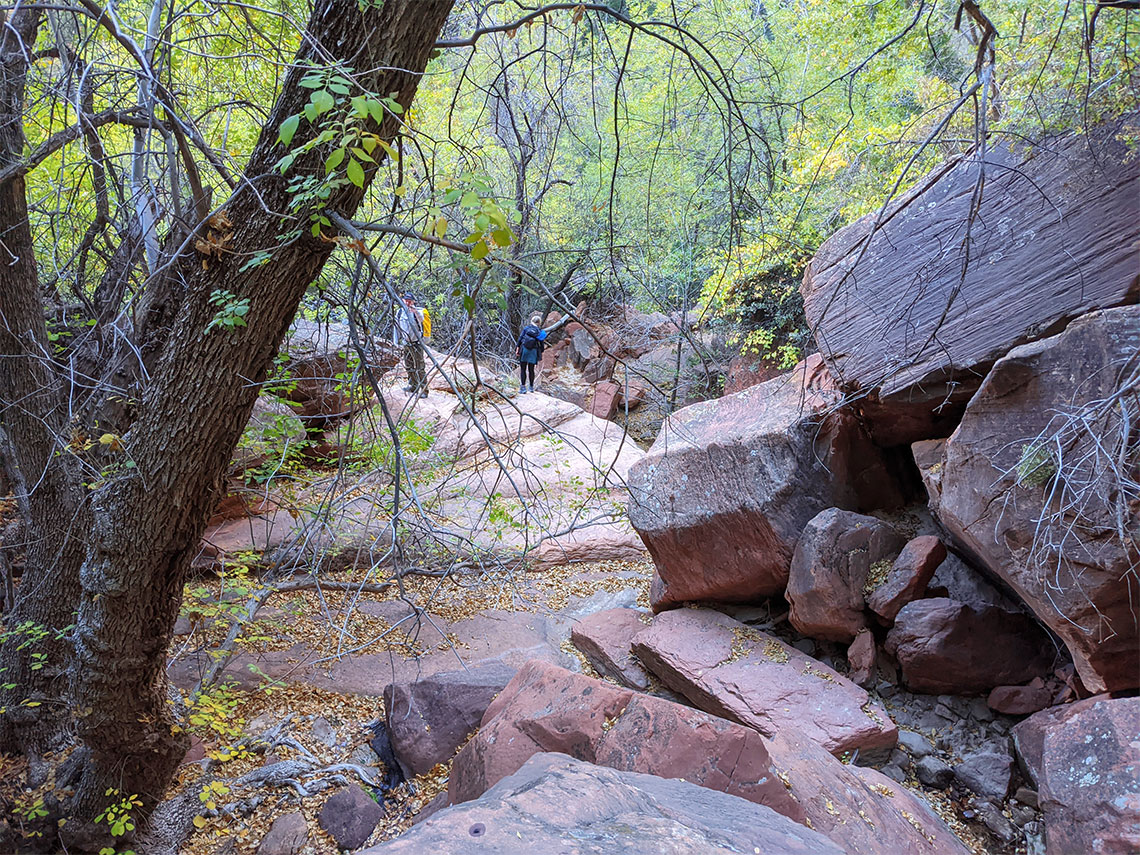 Scrambling down the boulders on the exit of Behunin Canyon
