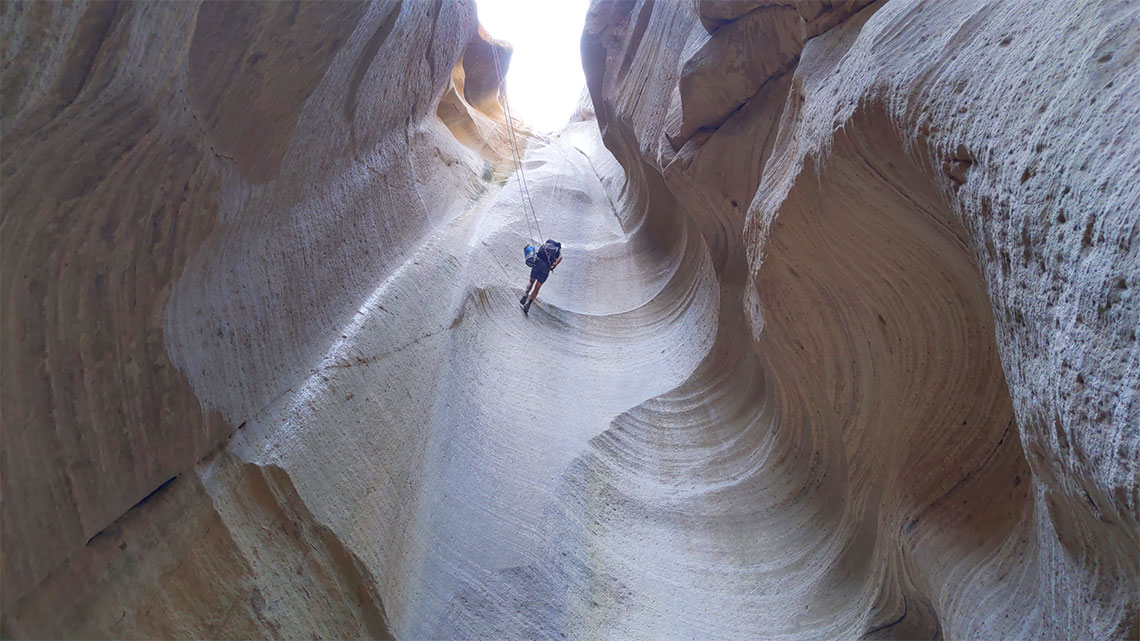 Going dow the first rappel in Englestead Hollow Canyon
