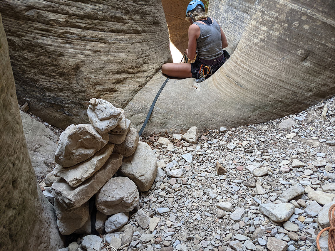 Rappel 10 cairn anchor on canyon floor