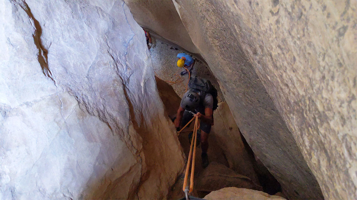 Descending the 3rd rappel in Englestead Hollow