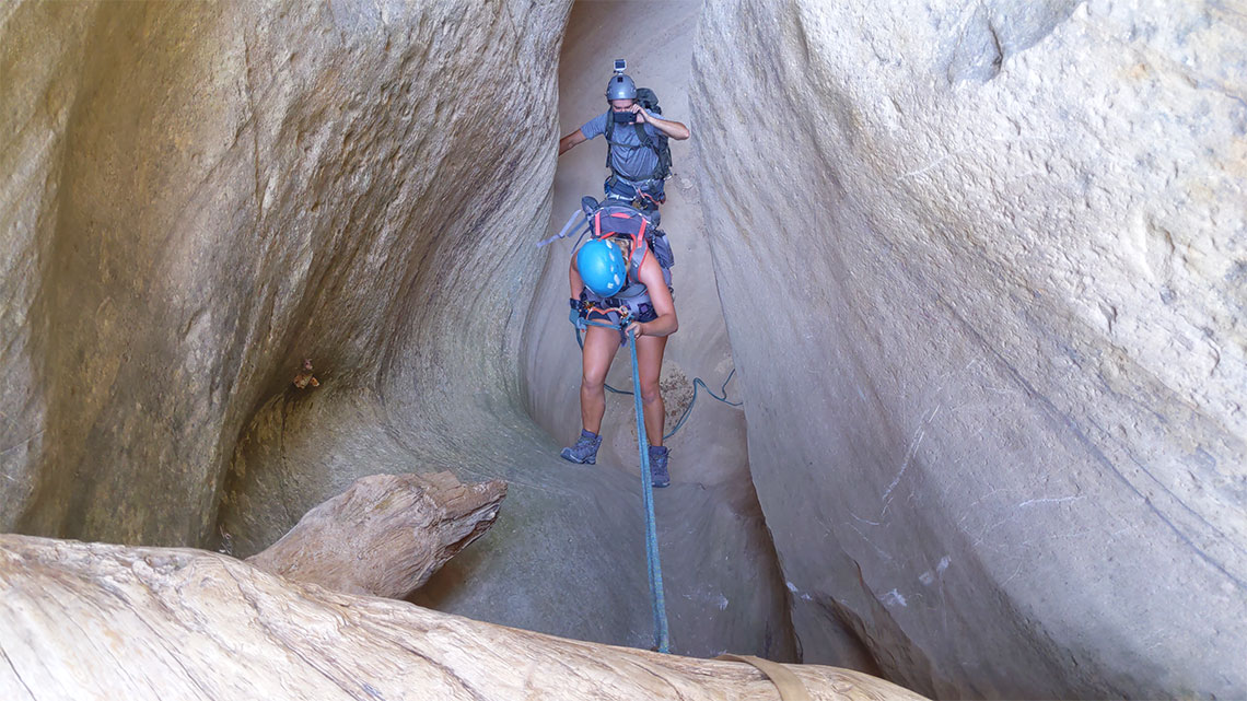 Going down a short rappel 6 in Englestead Canyon