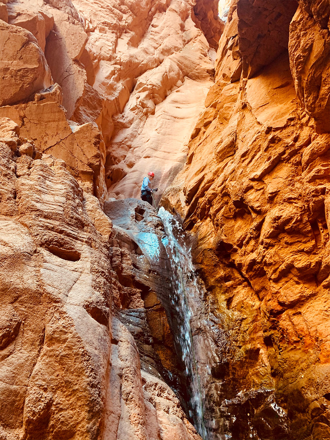 Beginning the 2nd drop of the 2nd rappel in Benson Creek