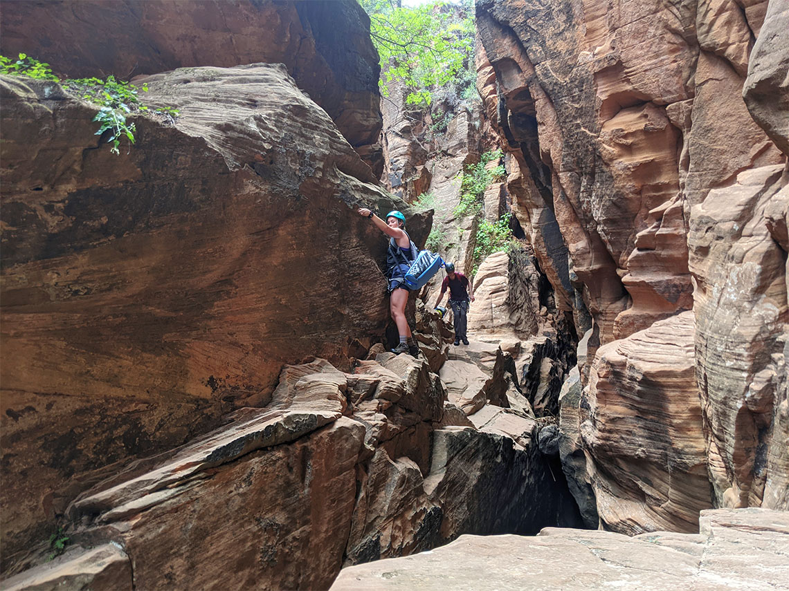 Making the traverse above water in Behunin Canyon