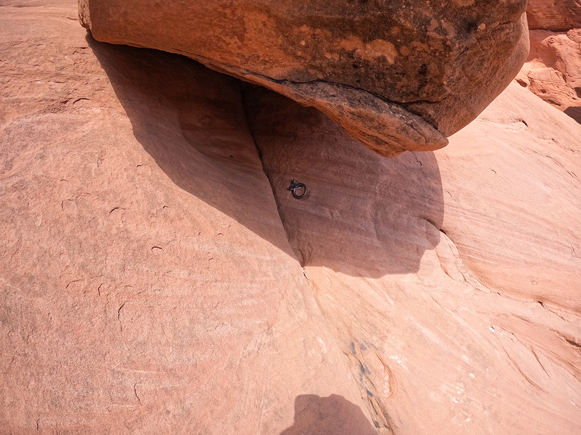 A single bolt provides an anchor for rappel 1 in U-Turn Canyon