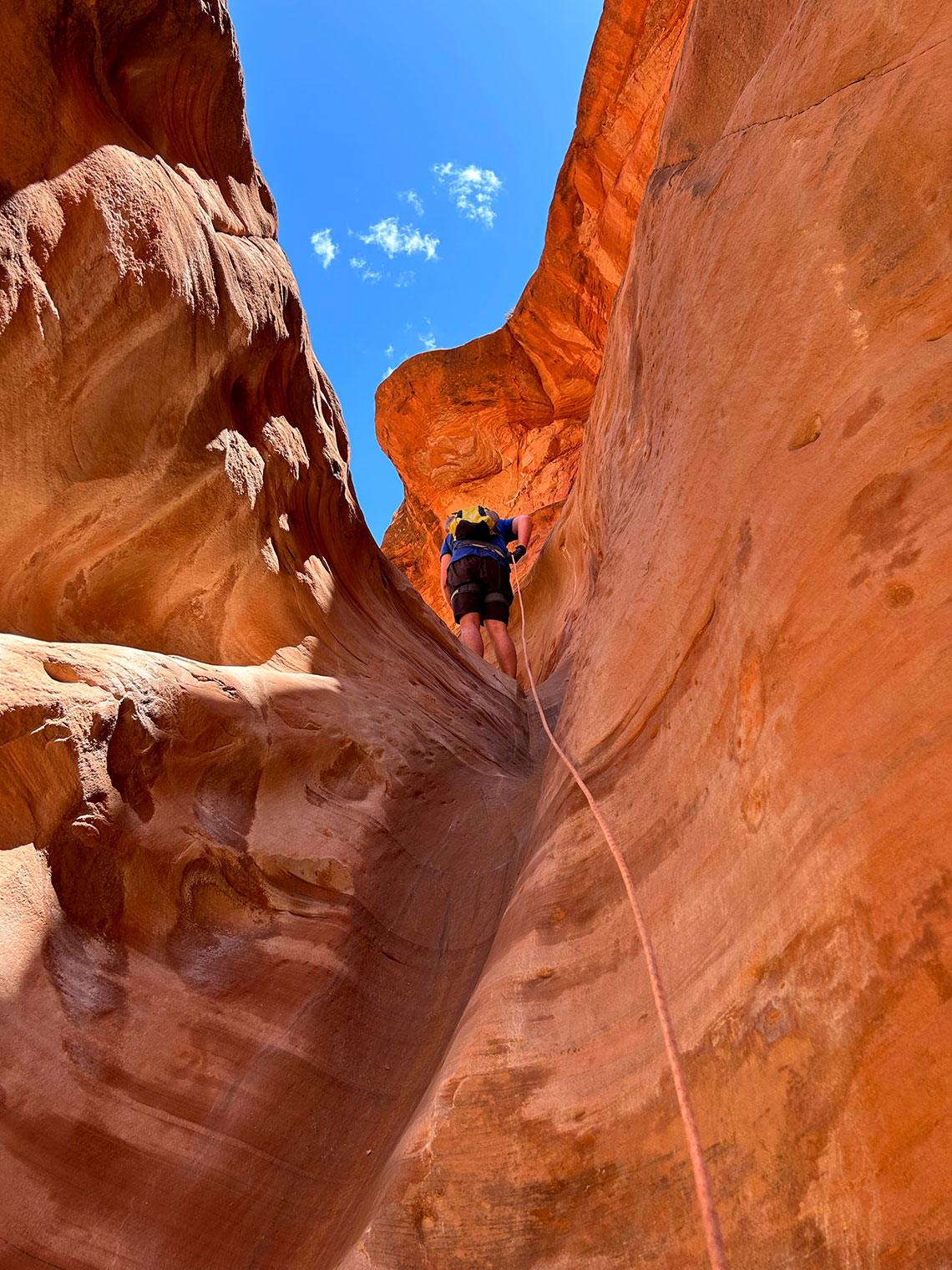 Rappelling the short drop of rappel 2 in Sunglow Canyon