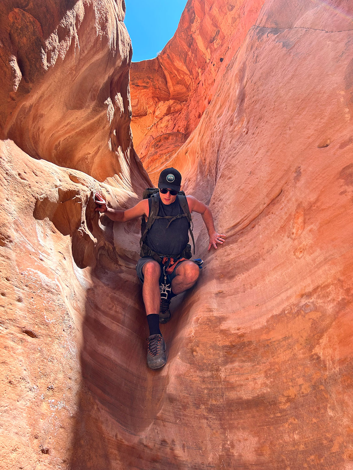 Downclimbing the second drop in Sunglow Canyon