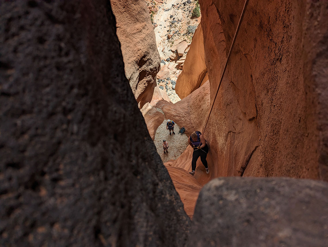 Descending the fourth rappel in Pete's Dragon Canyon