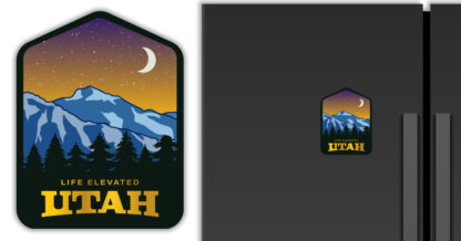 Utah magnet with view of Wasatch mountains at night, displayed on a refrigerator